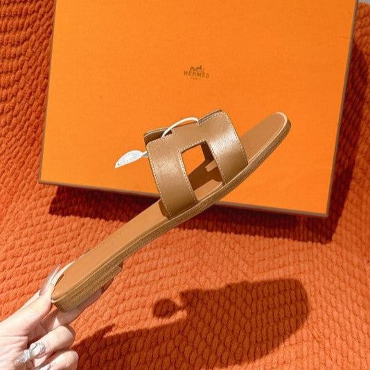 Hermes - « Claquettes Gold »