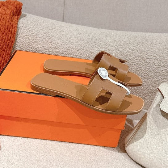 Hermes - « Claquettes Gold »
