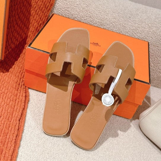 Hermes - « Claquettes Gold »