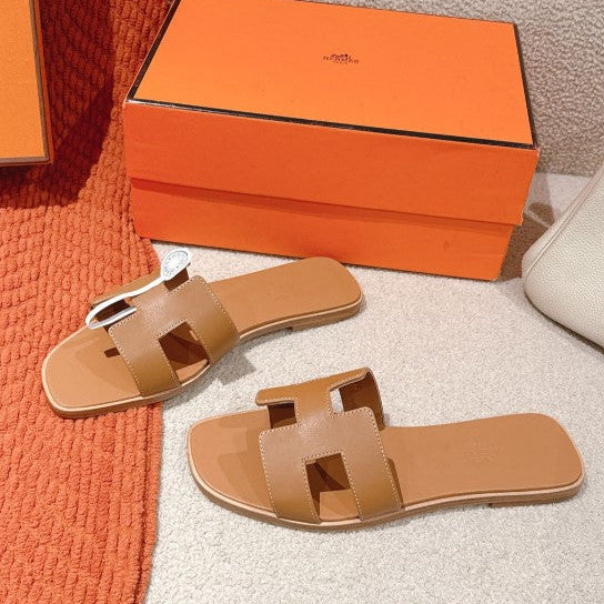Hermes - « Claquettes Gold »
