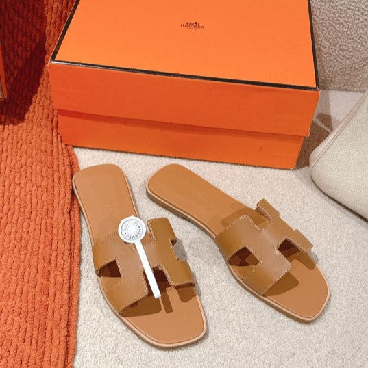 Hermes - « Claquettes Gold »