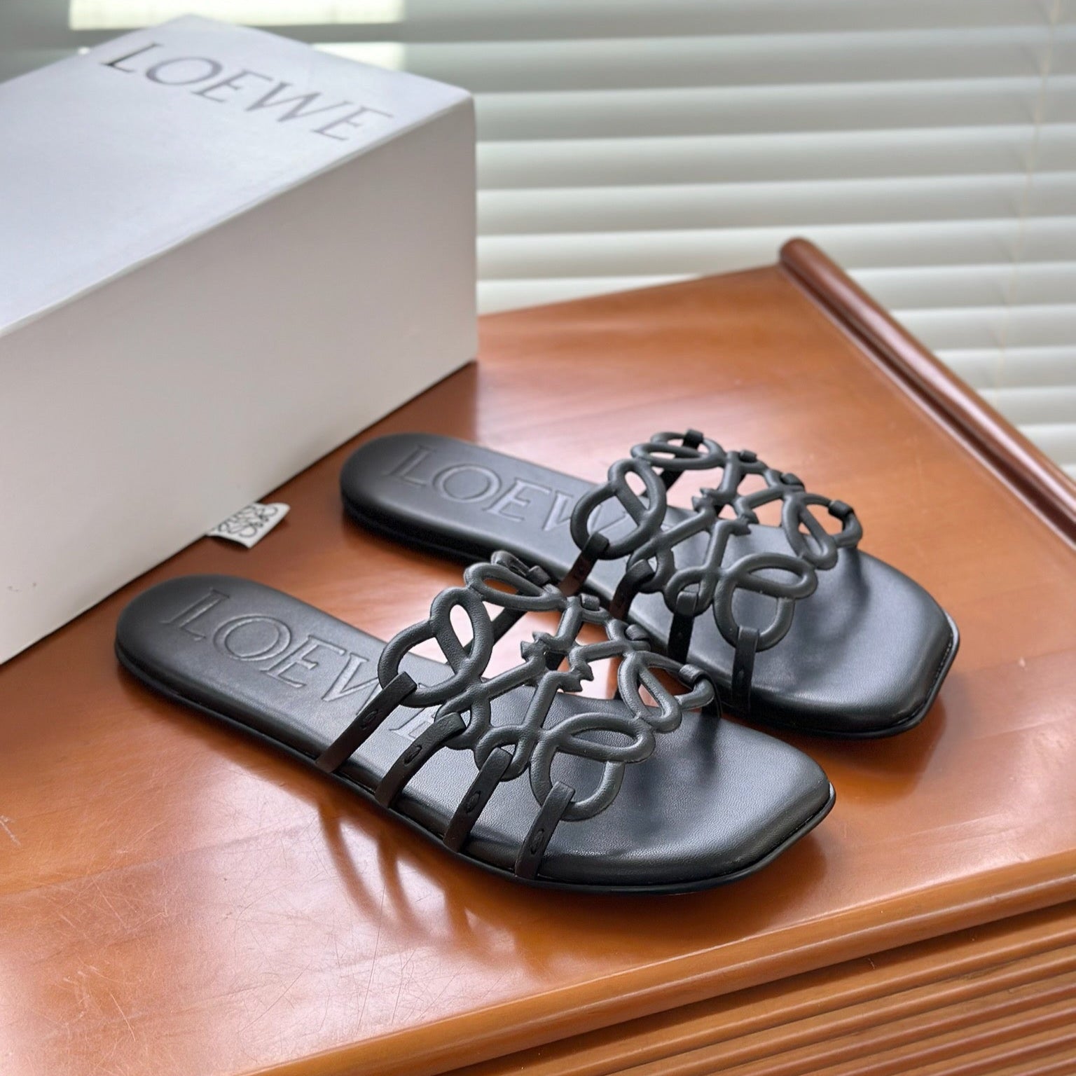 LOEWE - « Petal Anagram slide in soft calfskin Noire »