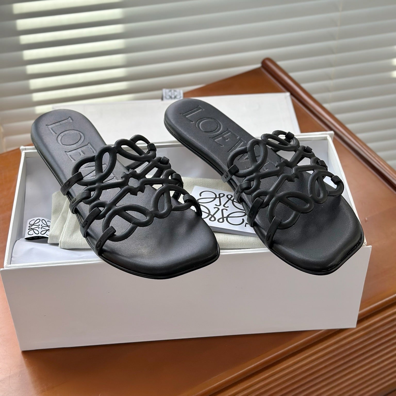 LOEWE - « Petal Anagram slide in soft calfskin Noire »