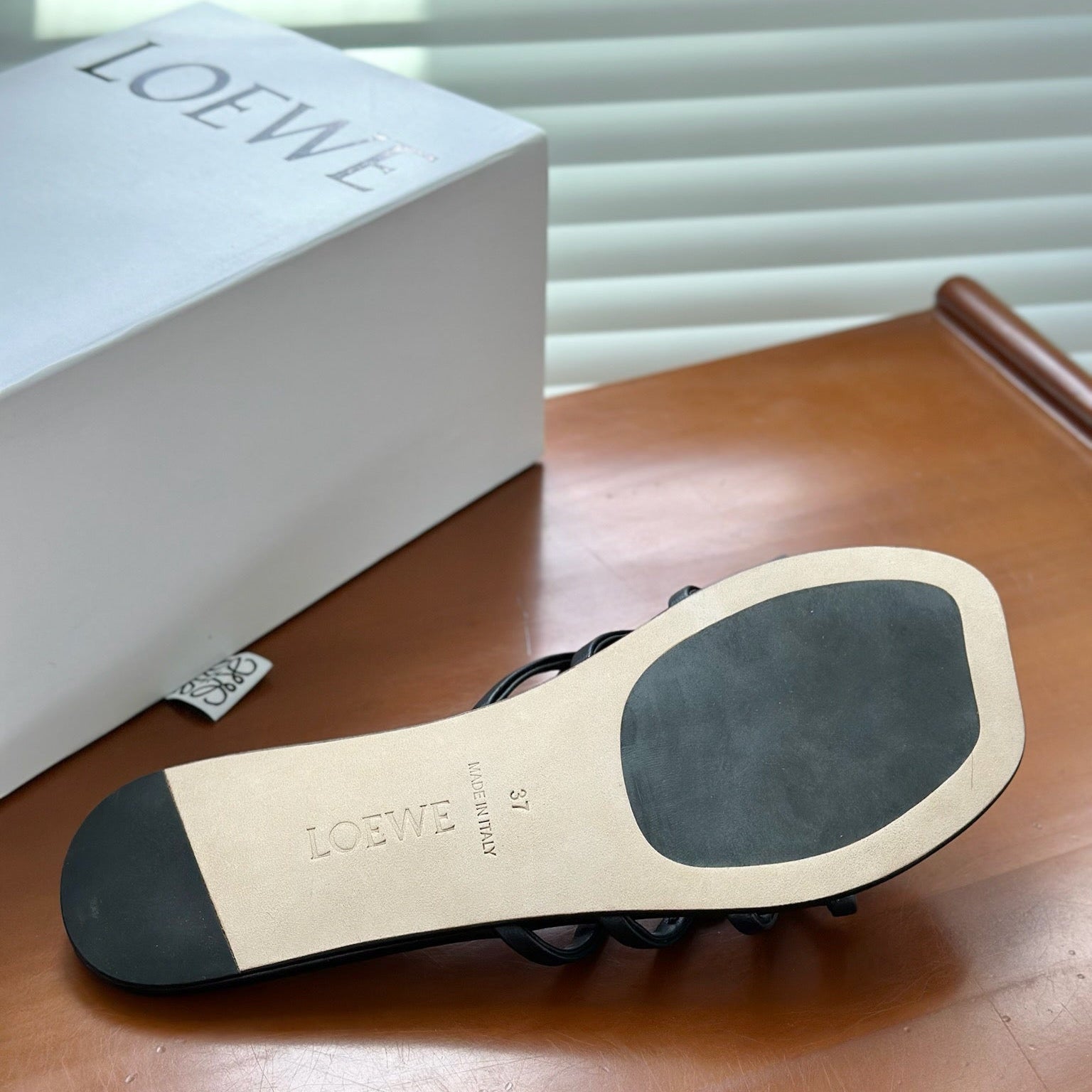 LOEWE - « Petal Anagram slide in soft calfskin Noire »